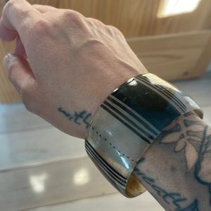 This is a beautiful cowhorn bracelet from Senegal.